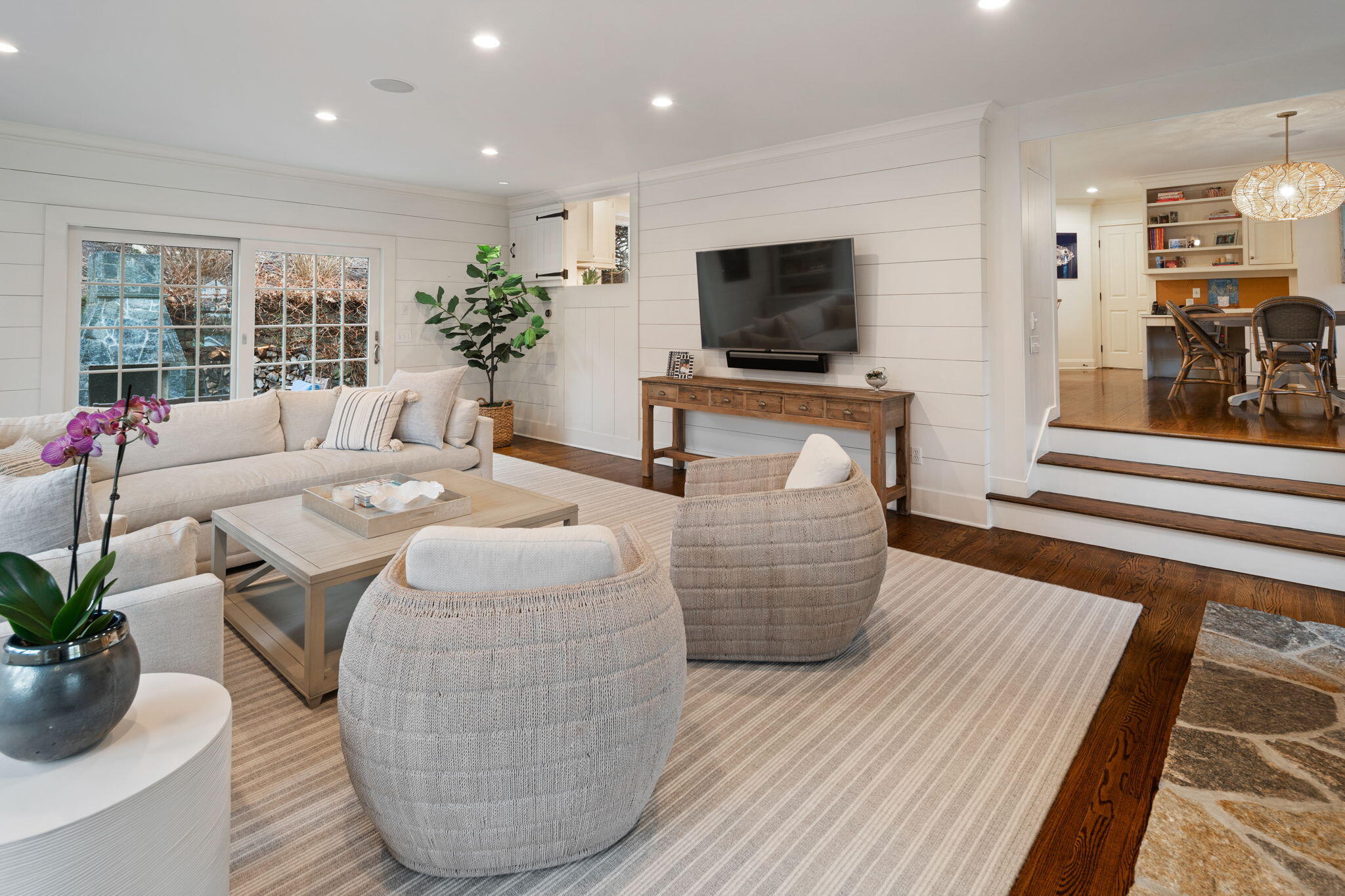 4 Green Beech Drive Rowayton, CT 06853 - Photo 9 of 39 a living room with furniture potted plant and a flat screen tv