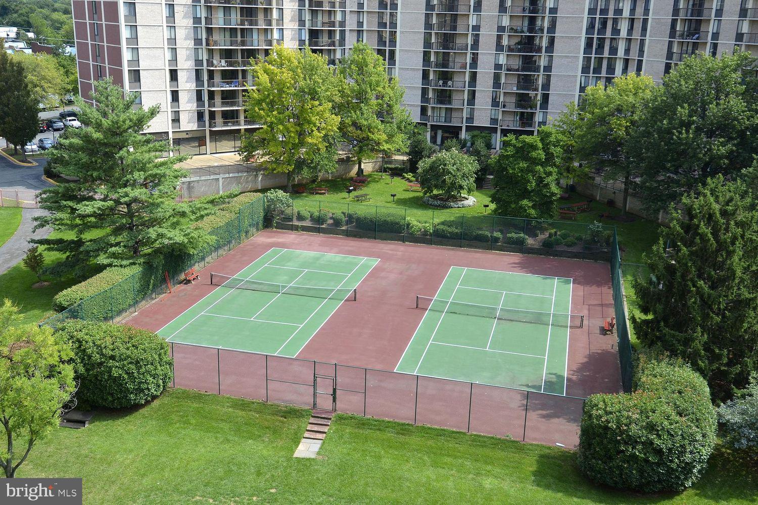 6800 Fleetwood Road, Unit 1004 McLean, VA 22101 - Photo 24 of 40 Inviting tennis courts in lush setting.