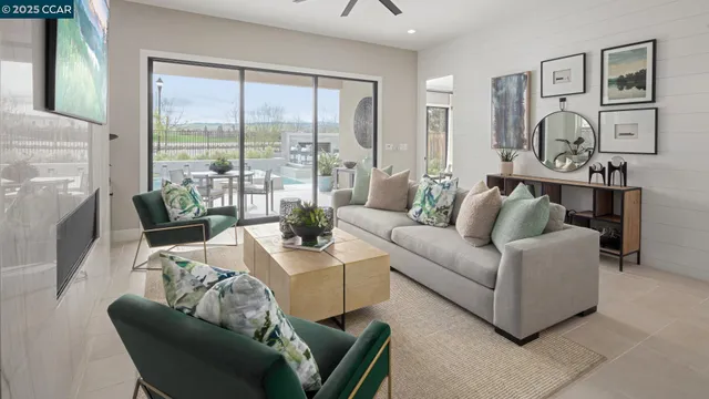 a living room with furniture and floor to ceiling windows