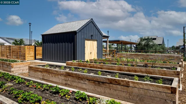 an aerial view of a houses with a city view