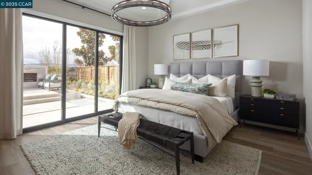 a bedroom with a bed and a large window