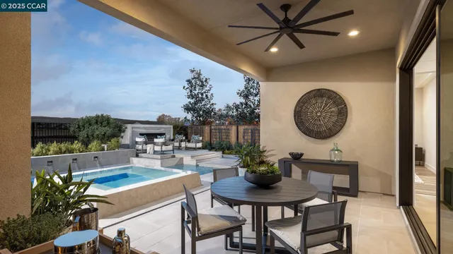 a view of a dining room with furniture and a kitchen