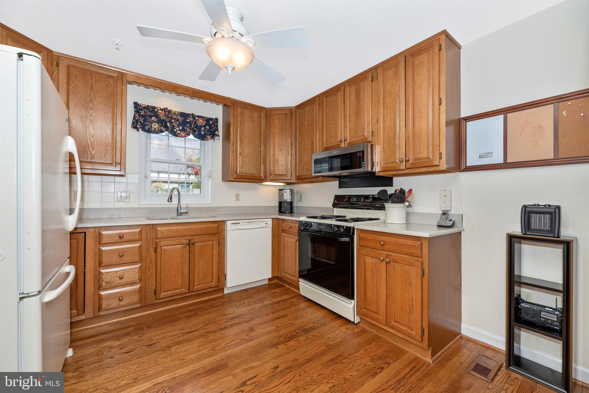 2389 Bear Den Road Frederick, MD 21701 - Photo 12 of 47 Hardwood flooring and oak cabinets.