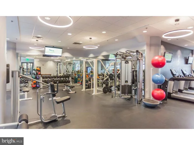 a room with lots of gym equipment