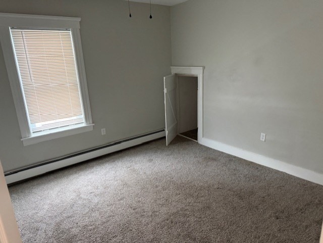 21 Sylvan Street, Unit 1 Worcester, MA 01603 - Photo 8 of 10 an empty room with windows