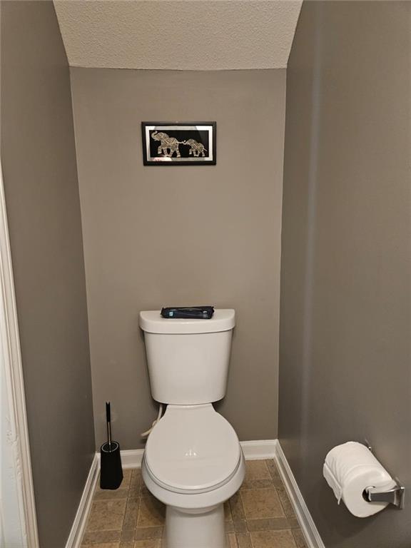 2238 Bigwood Trail Atlanta, GA 30349 - Photo 15 of 20 a bathroom with a toilet
