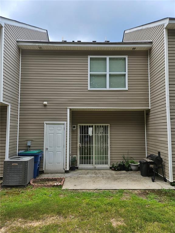 2238 Bigwood Trail Atlanta, GA 30349 - Photo 20 of 20 a front view of a house with a yard and garage