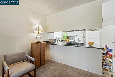 a kitchen with stainless steel appliances a refrigerator and a sink
