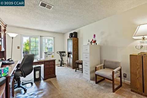 a workspace with furniture and a window