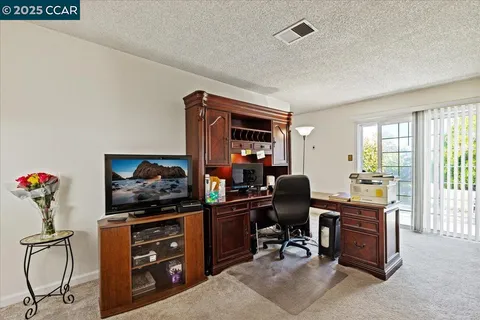 a room with furniture and musical instruments
