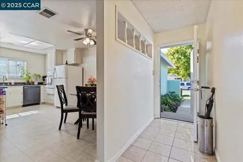 a view of a livingroom with furniture and a window