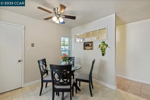 a dining room with furniture and window