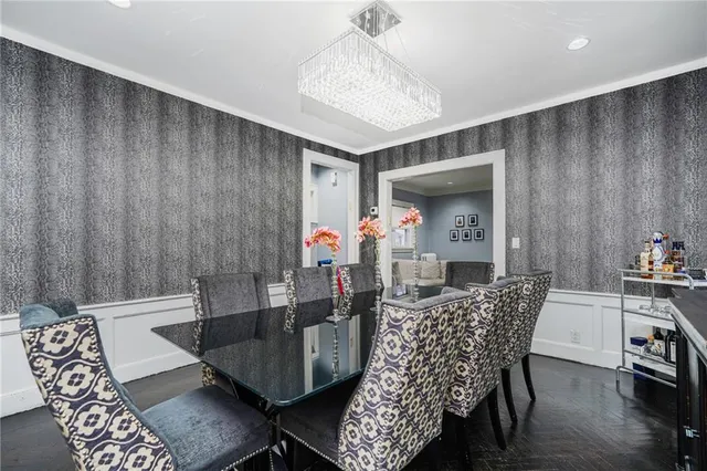 a dining room with furniture and wooden floor