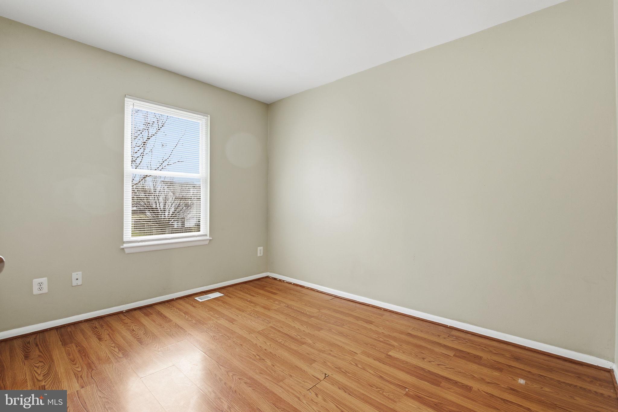 21 Ute Court Middle River, MD 21220 - Photo 28 of 36 wooden floor in an empty room with a window