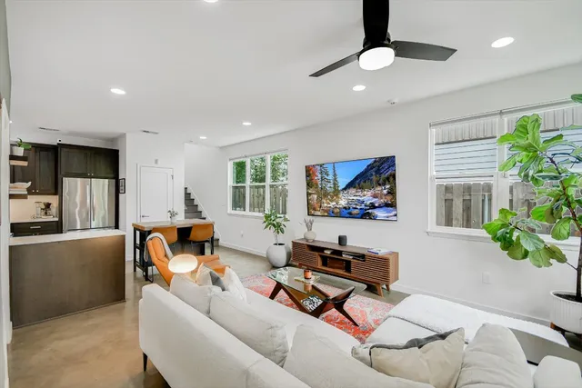 a living room with furniture and a large window