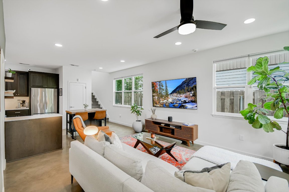 2414 East Martin Luther King Jr Boulevard, Unit A Austin, TX 78722 - Photo 14 of 32 a living room with furniture and a flat screen tv