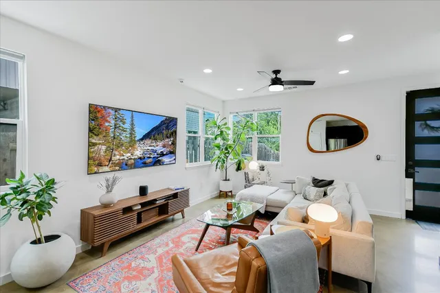 a large kitchen with a table and chairs in it