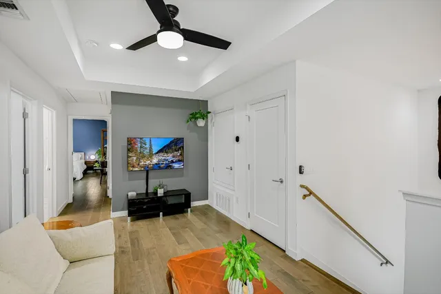 a bedroom with a bed and a flat tv screen