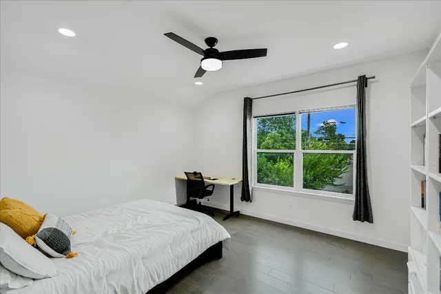 a aerial view of a house with a yard and potted plants