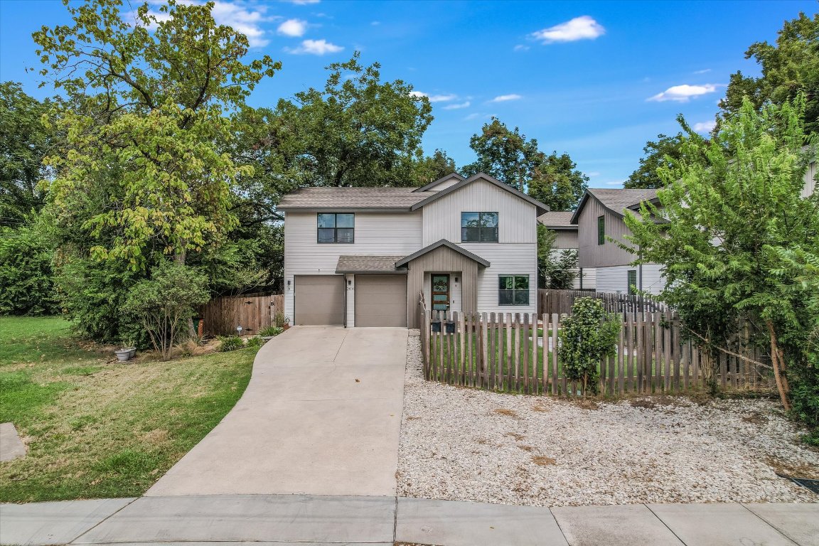 2414 East Martin Luther King Jr Boulevard, Unit A Austin, TX 78722 - Photo 27 of 32 a front view of a house with a garden