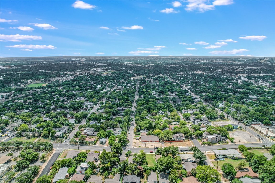 2414 East Martin Luther King Jr Boulevard, Unit A Austin, TX 78722 - Photo 31 of 32 an aerial view of residential houses with outdoor space and trees