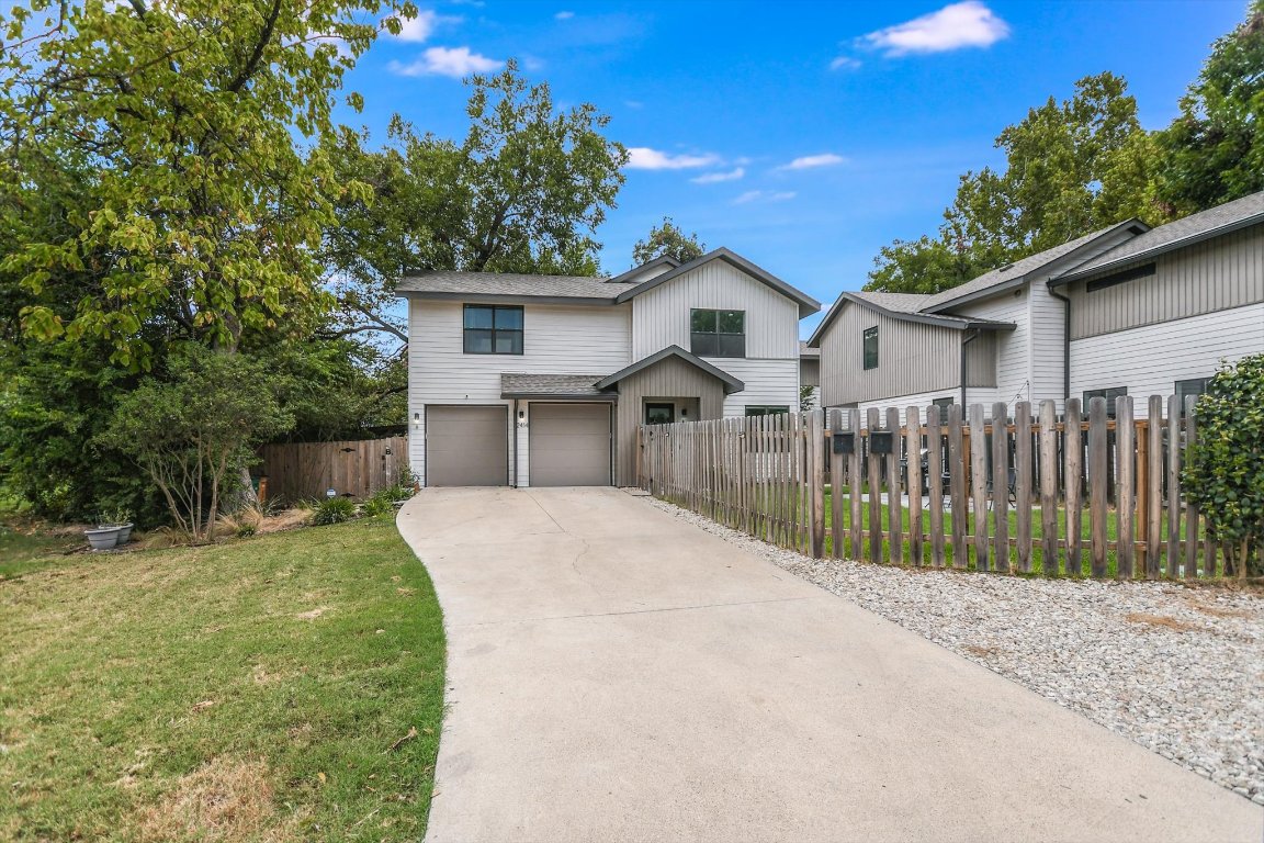 2414 East Martin Luther King Jr Boulevard, Unit A Austin, TX 78722 - Photo 8 of 32 a view of a house with a yard and potted plants