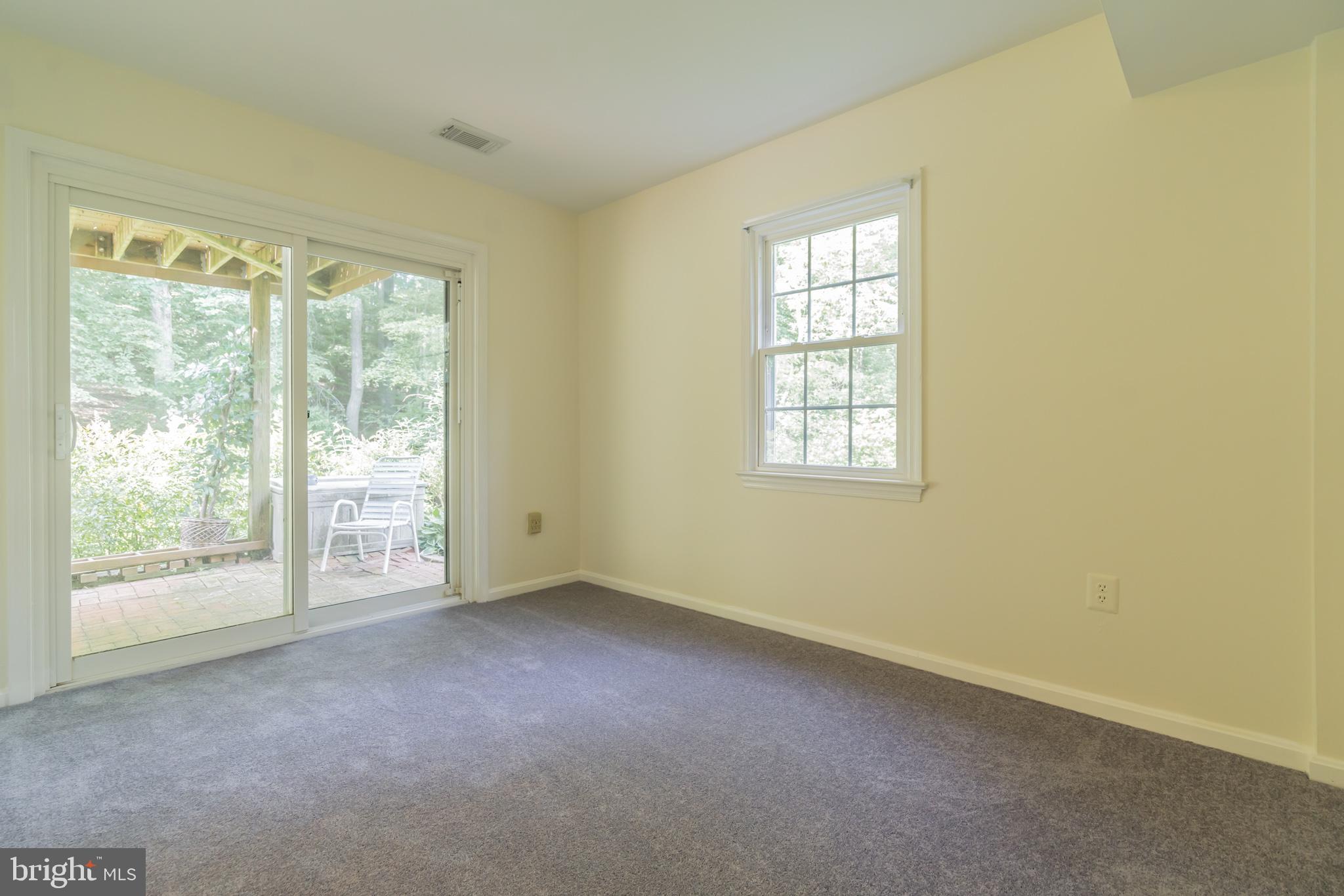 7628 Chancellor Way Springfield, VA 22153 - Photo 22 of 30 Lower Level Bedroom w/ Sliding Glass Door to Patio