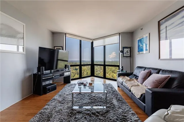 a living room with furniture and a large window