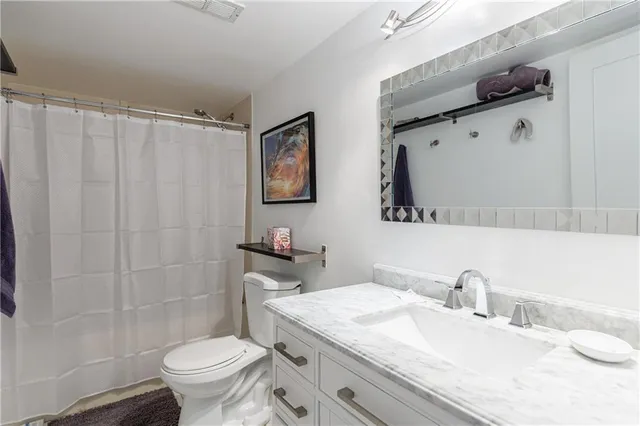 a room with furniture pool table and workspace