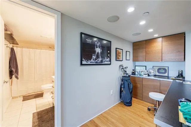 a view of a hallway with seating area
