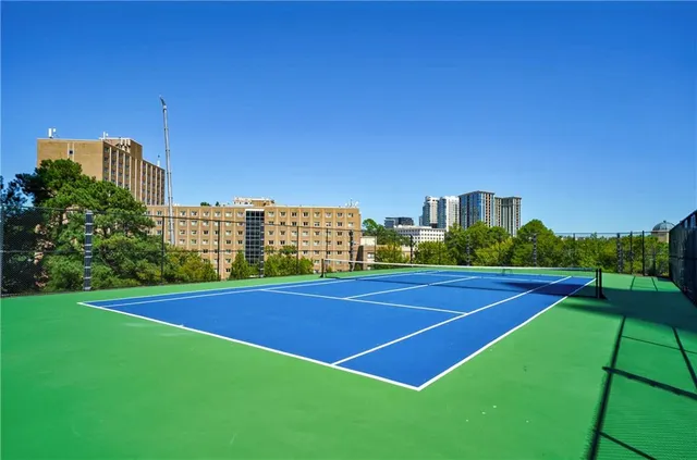 a view of a building with a yard