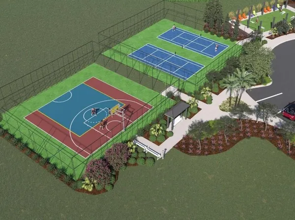 an aerial view of a tennis ground and a yard