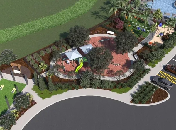an aerial view of a house with a yard and lake view