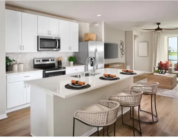 a kitchen with a dining table and chairs