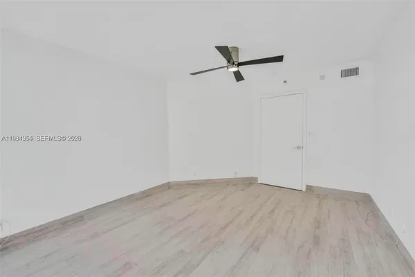 a bathroom with a double vanity sink and mirror