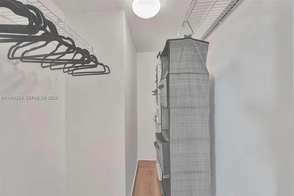 a bathroom with a double vanity sink mirror and shower