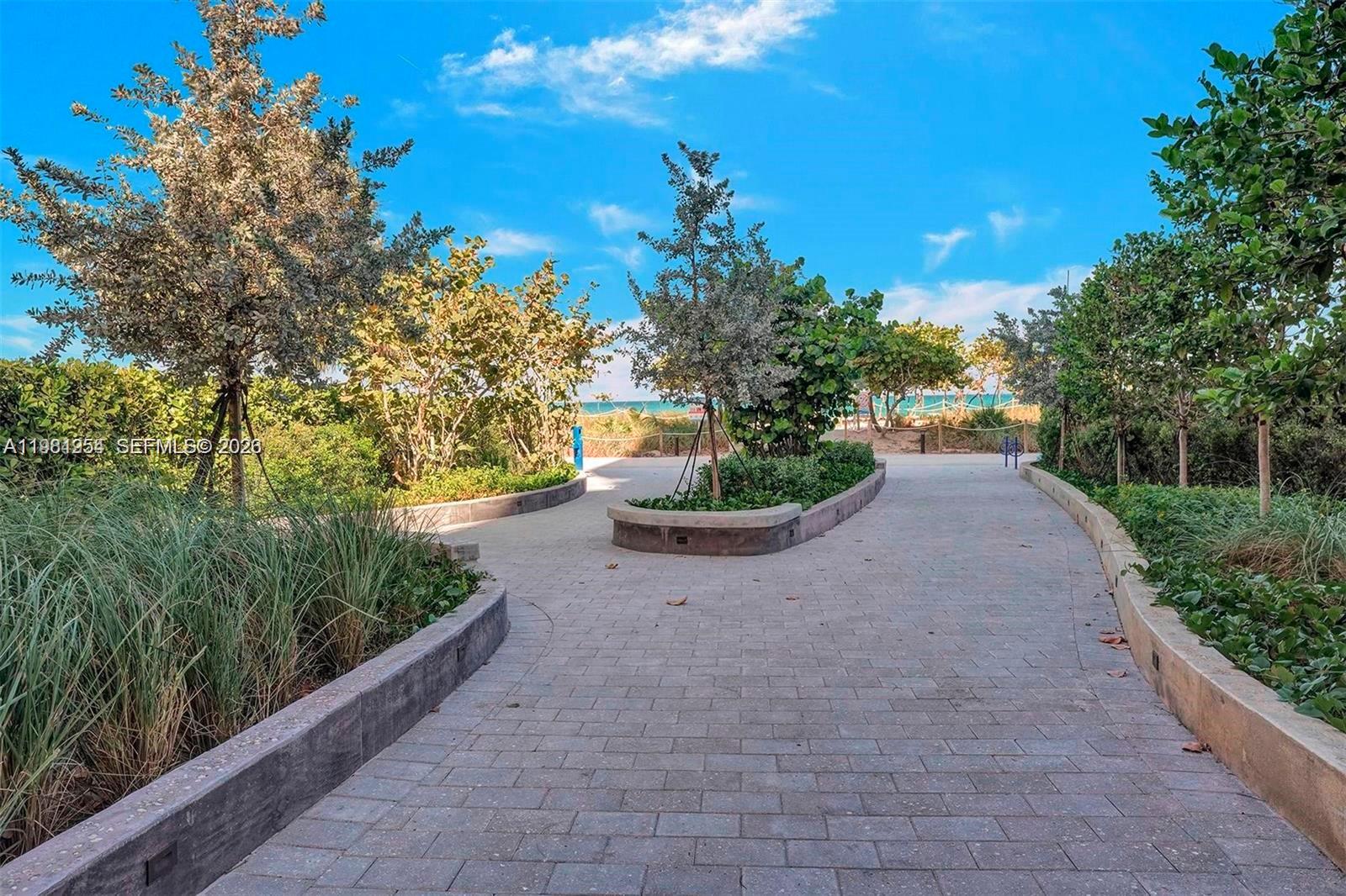 8911 Collins Avenue, Unit 703 Surfside, FL 33154 - Photo 20 of 24 a view of a yard with plants