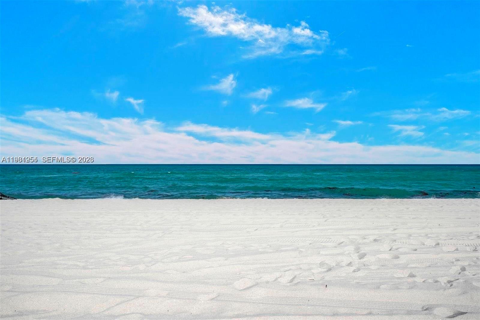 8911 Collins Avenue, Unit 703 Surfside, FL 33154 - Photo 21 of 24 a view of beach with an ocean view