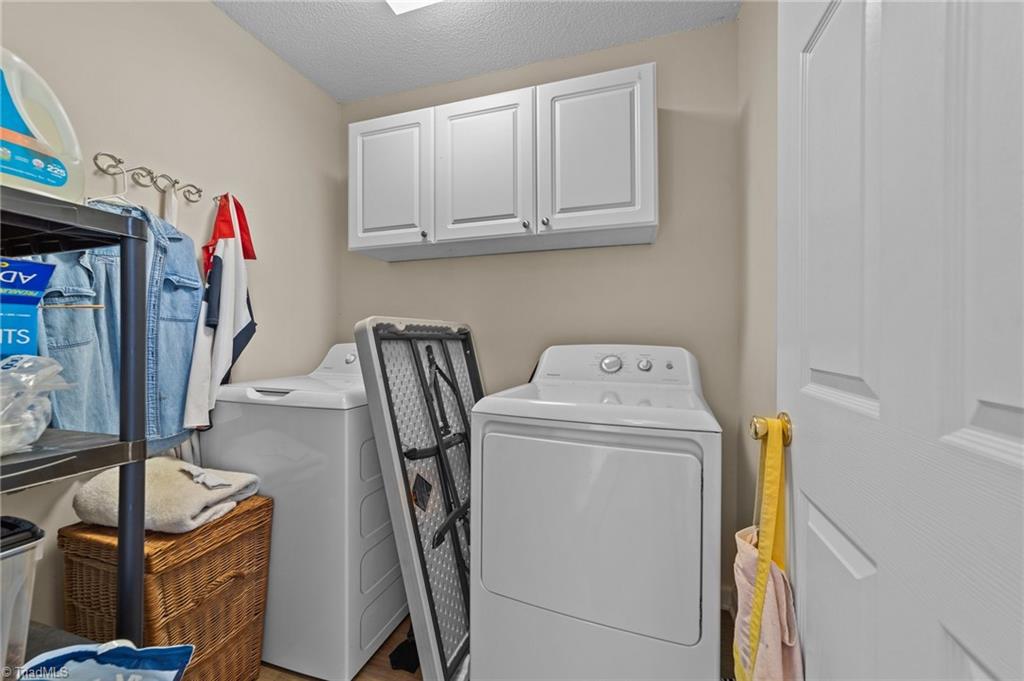 2852 WaterStone Loop High Point, NC 27265 - Photo 10 of 32 Laundry room at the end of the hallway to the bedrooms.