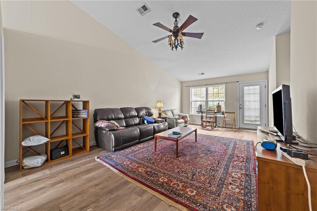 2852 WaterStone Loop High Point, NC 27265 - Photo 19 of 32 Living room with ceiling fan.
