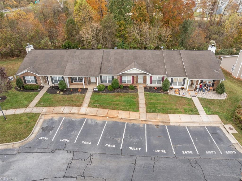 2852 WaterStone Loop High Point, NC 27265 - Photo 20 of 32 Aerial view of the townhome with the assigned parking spaces.