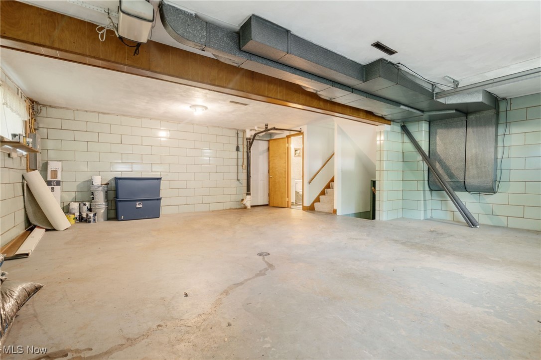 4895 3rd Street Northwest Canton, OH 44708 - Photo 18 of 27 Below grade area featuring stairs and concrete block wall