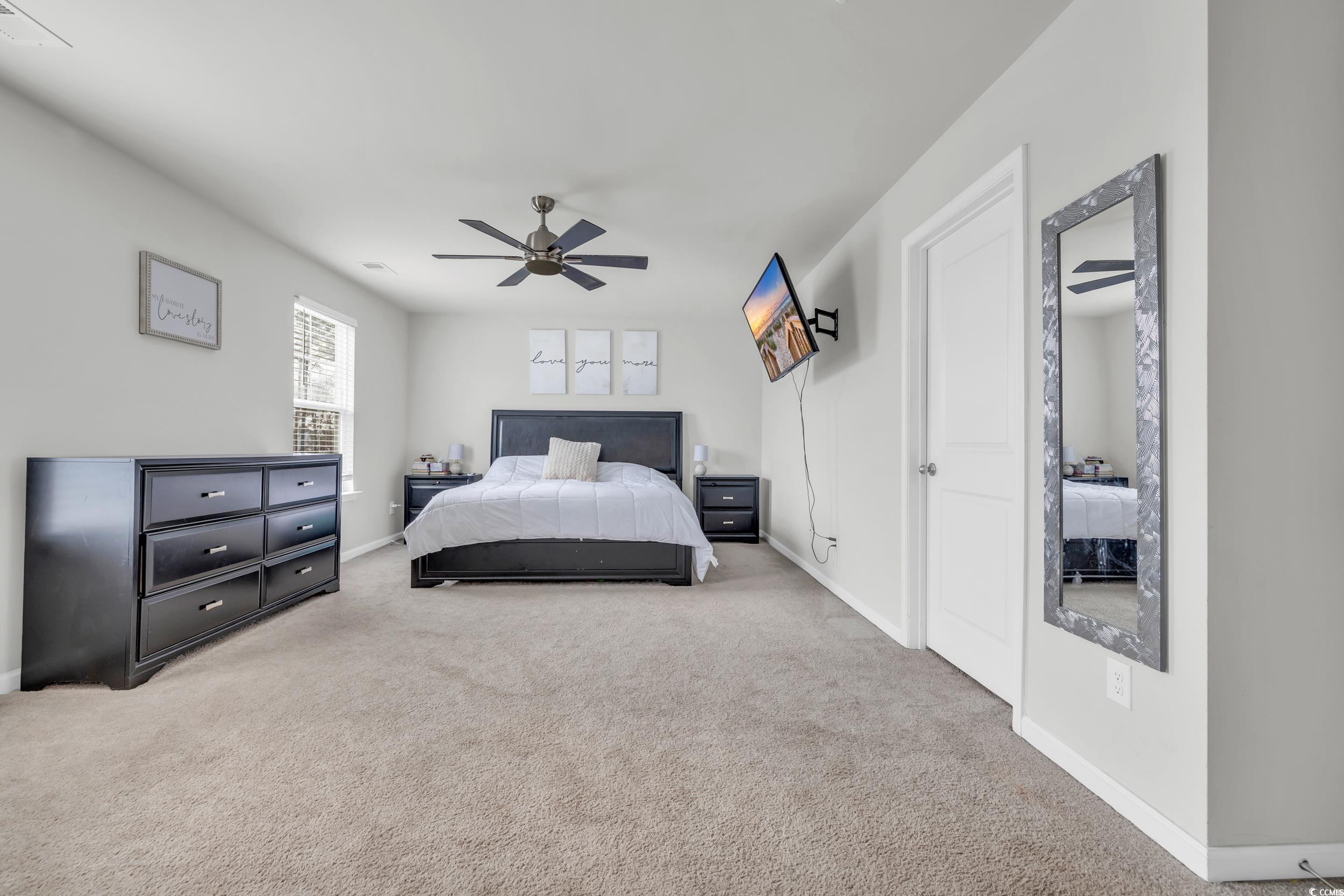 205 Black Pearl Way Myrtle Beach, SC 29588 - Photo 12 of 28 Carpeted bedroom featuring a ceiling fan and baseboards