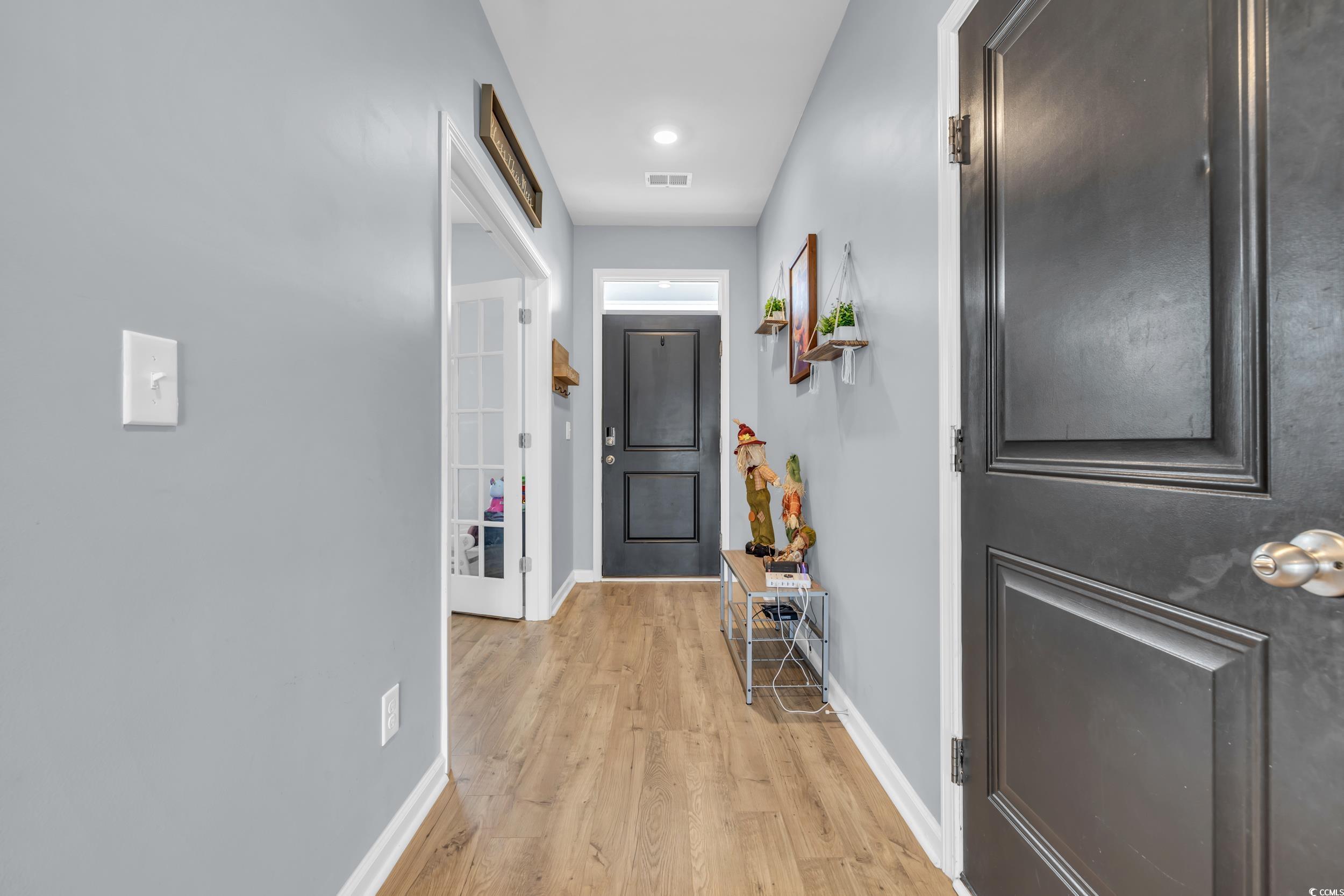 205 Black Pearl Way Myrtle Beach, SC 29588 - Photo 3 of 28 Corridor with baseboards and light wood-type flooring