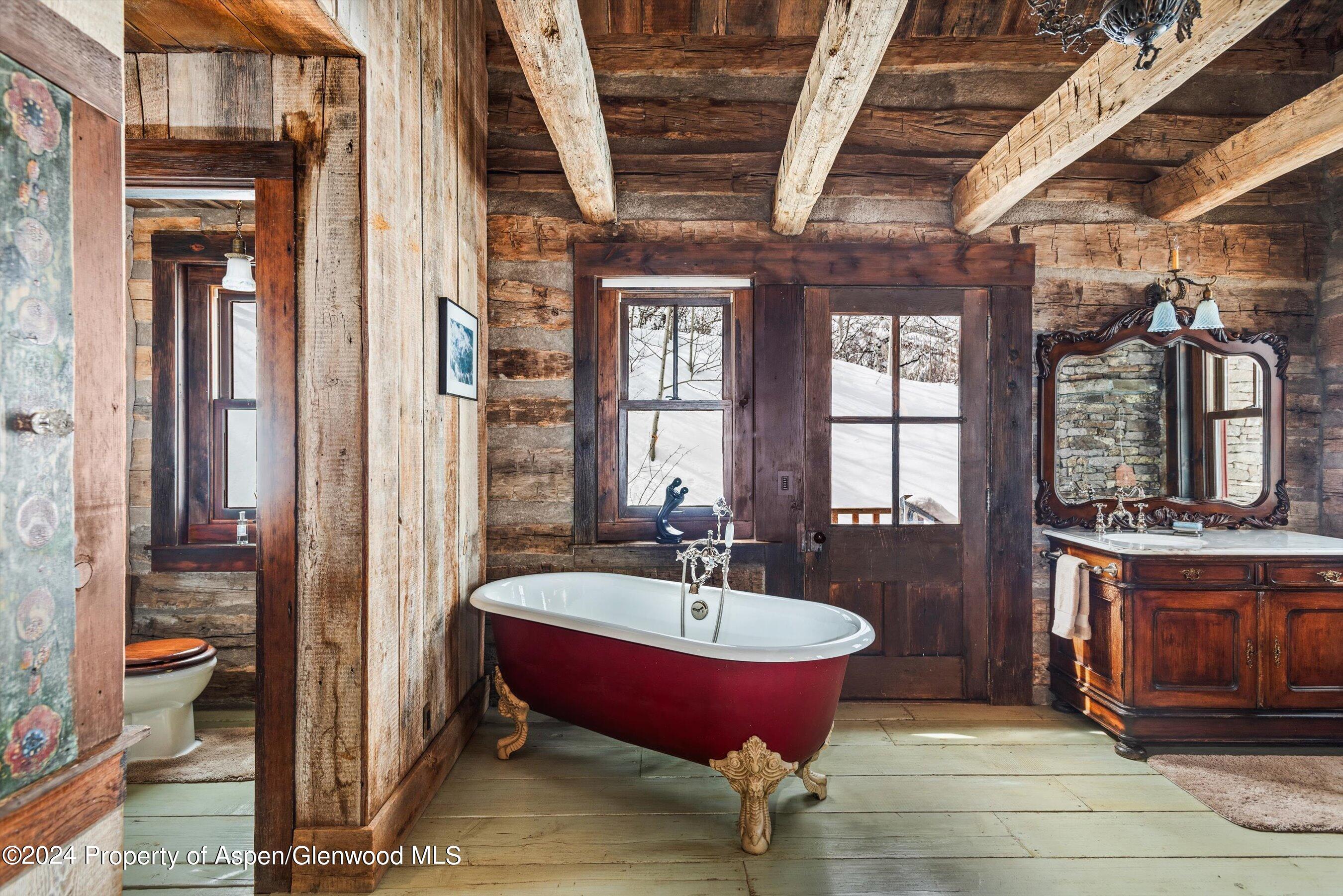 855 Moore Drive Aspen, CO 81611 - Photo 18 of 50 a bath room with a toilet and a mirror