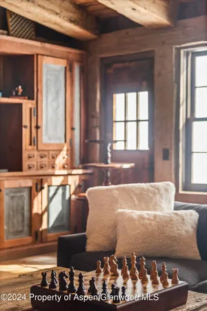 a bed room with a bed and a chandelier