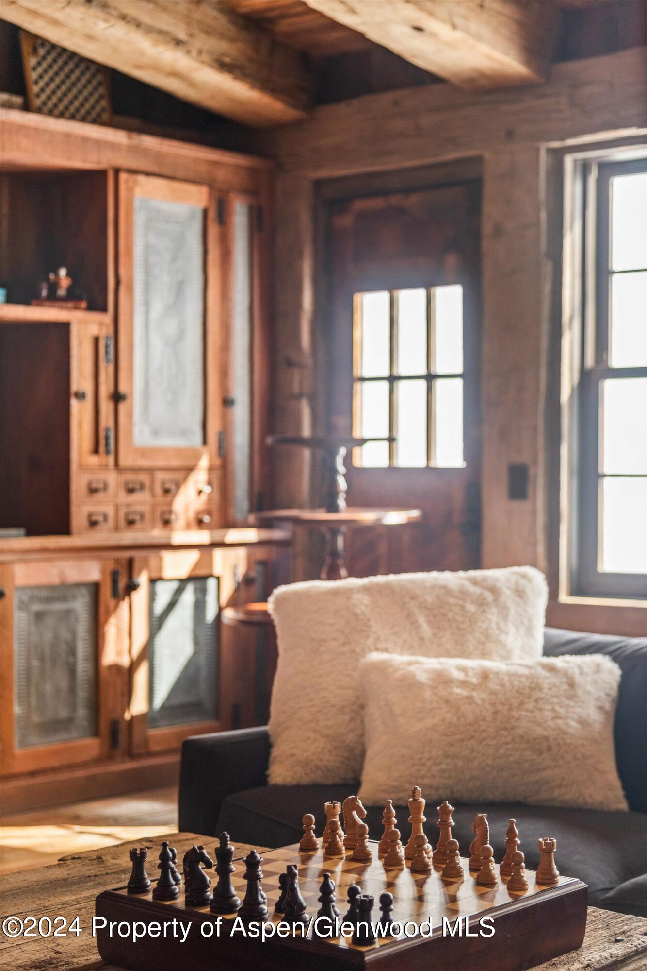 855 Moore Drive Aspen, CO 81611 - Photo 24 of 50 a bed sitting in a bedroom next to a window