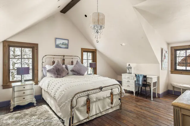 a bathroom with a sink a mirror and a shower