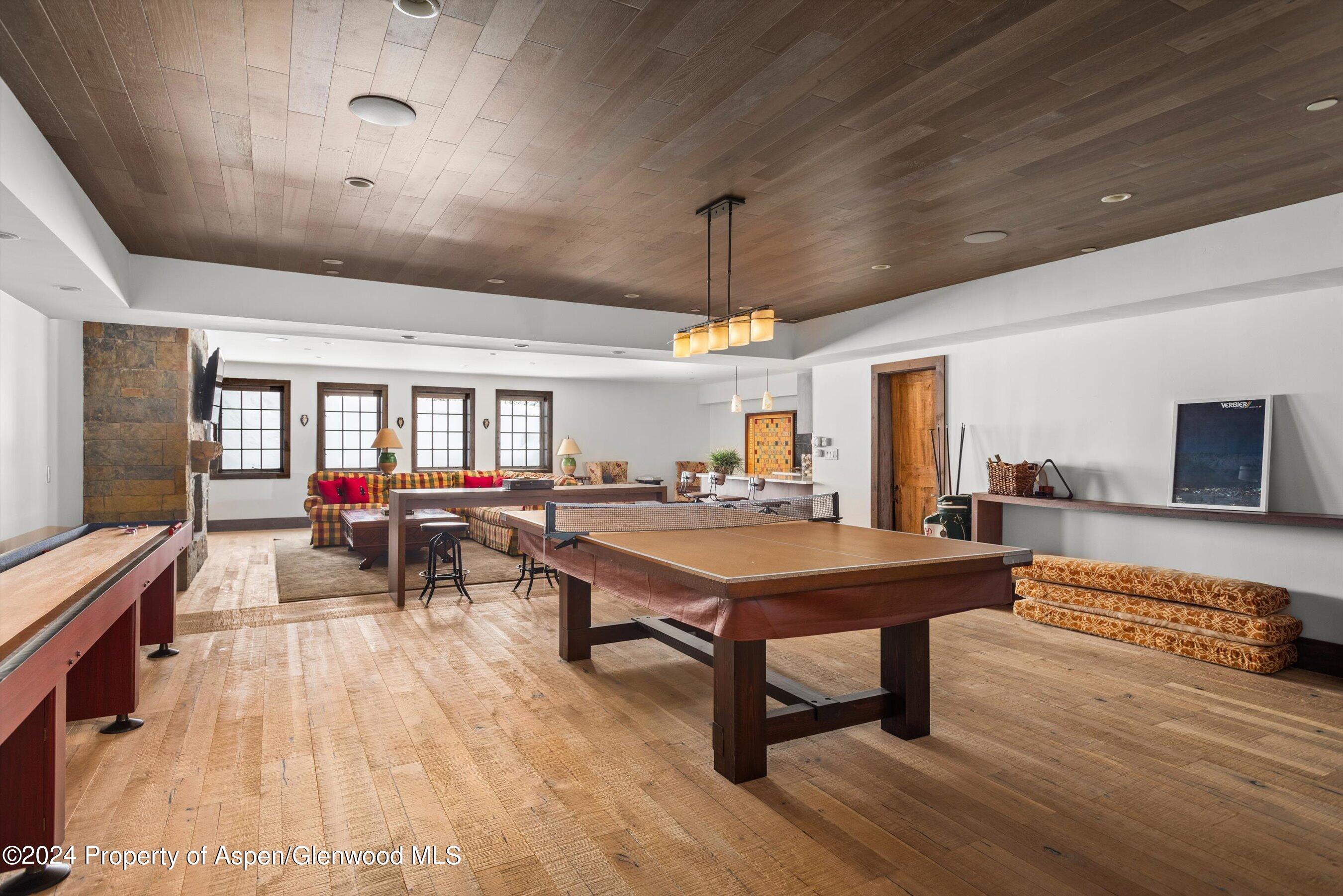 855 Moore Drive Aspen, CO 81611 - Photo 35 of 50 a room with furniture pool table flat screen tv and windows