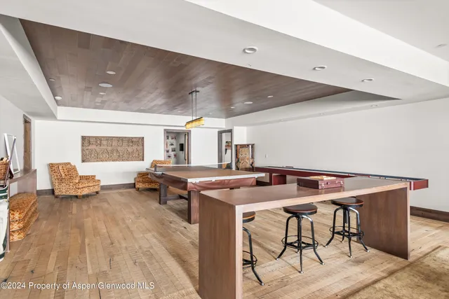 a kitchen with stainless steel appliances a sink a stove top oven a counter space and cabinets